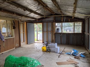 Main living area with partition wall still intact
