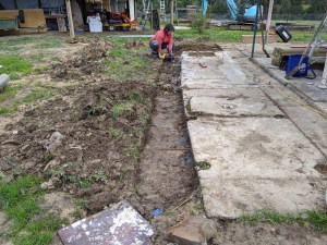 Benny boy drilling in holes into the existing slab for placing the reo-bars
